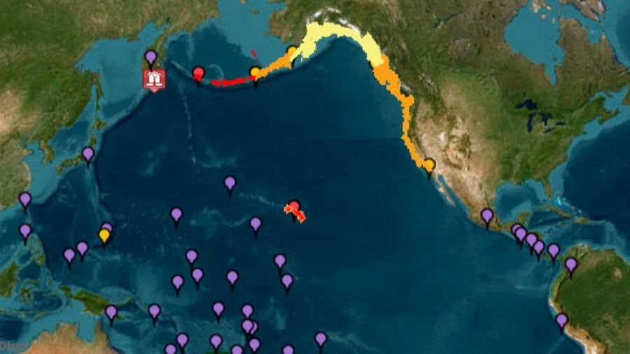 Dans cette image, du système d'alerte de tsunamis de l'administration nationale océanique et atmosphérique (NOAA), il montre les avertissements du tsunami (en rouge), des avis (orange), des surveillances (en jaune) et des menaces (en violet)